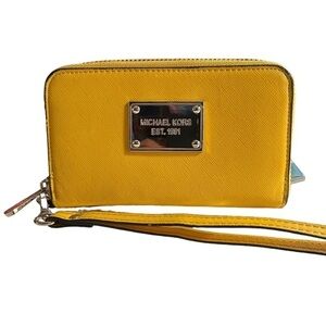 Michael Kors Jet Set Wristlet Wallet in vibrant yellow Saffiano leather.